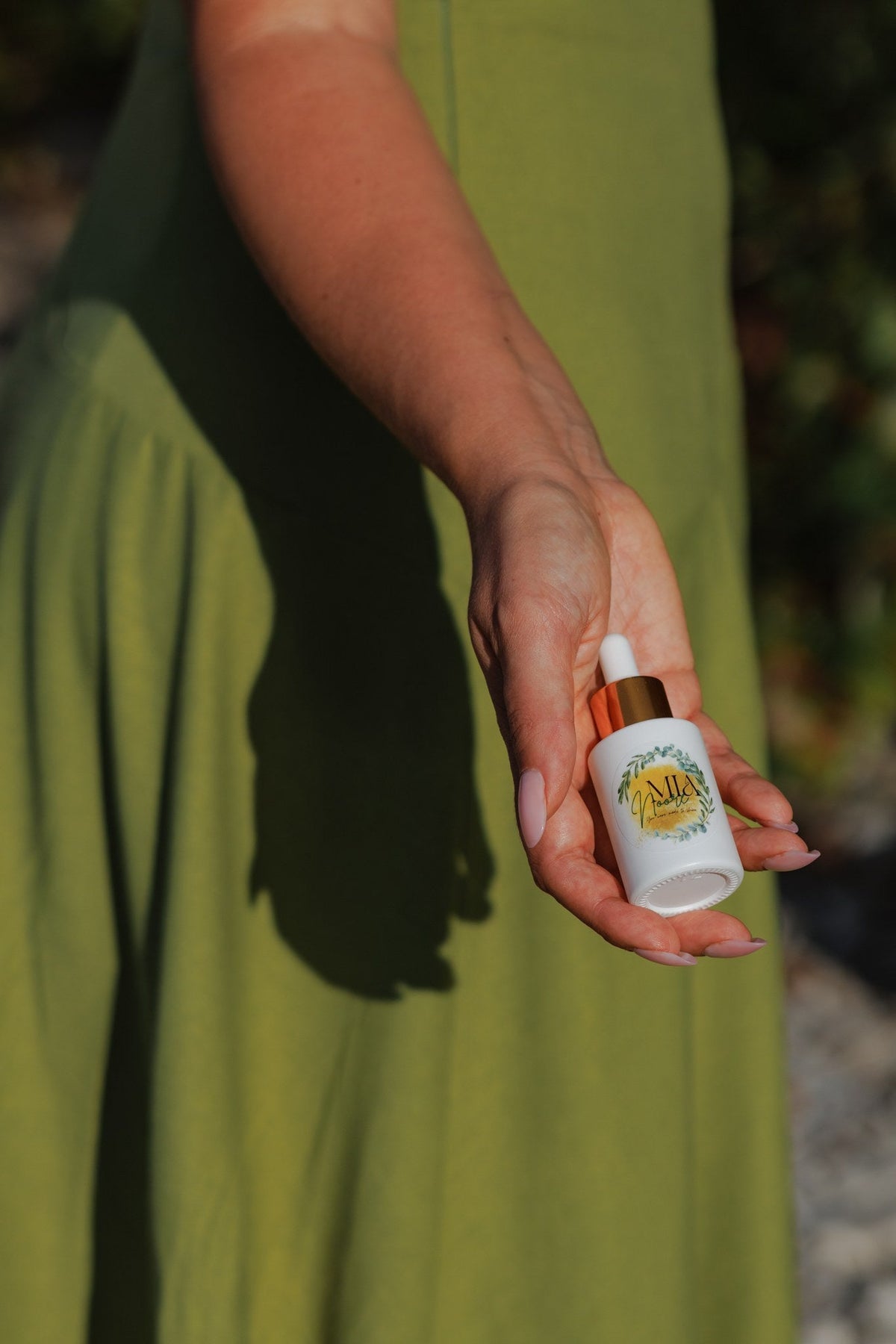 Mia Noore Balanced Harmony face oil held in hand, showing the 30 mL bottle size