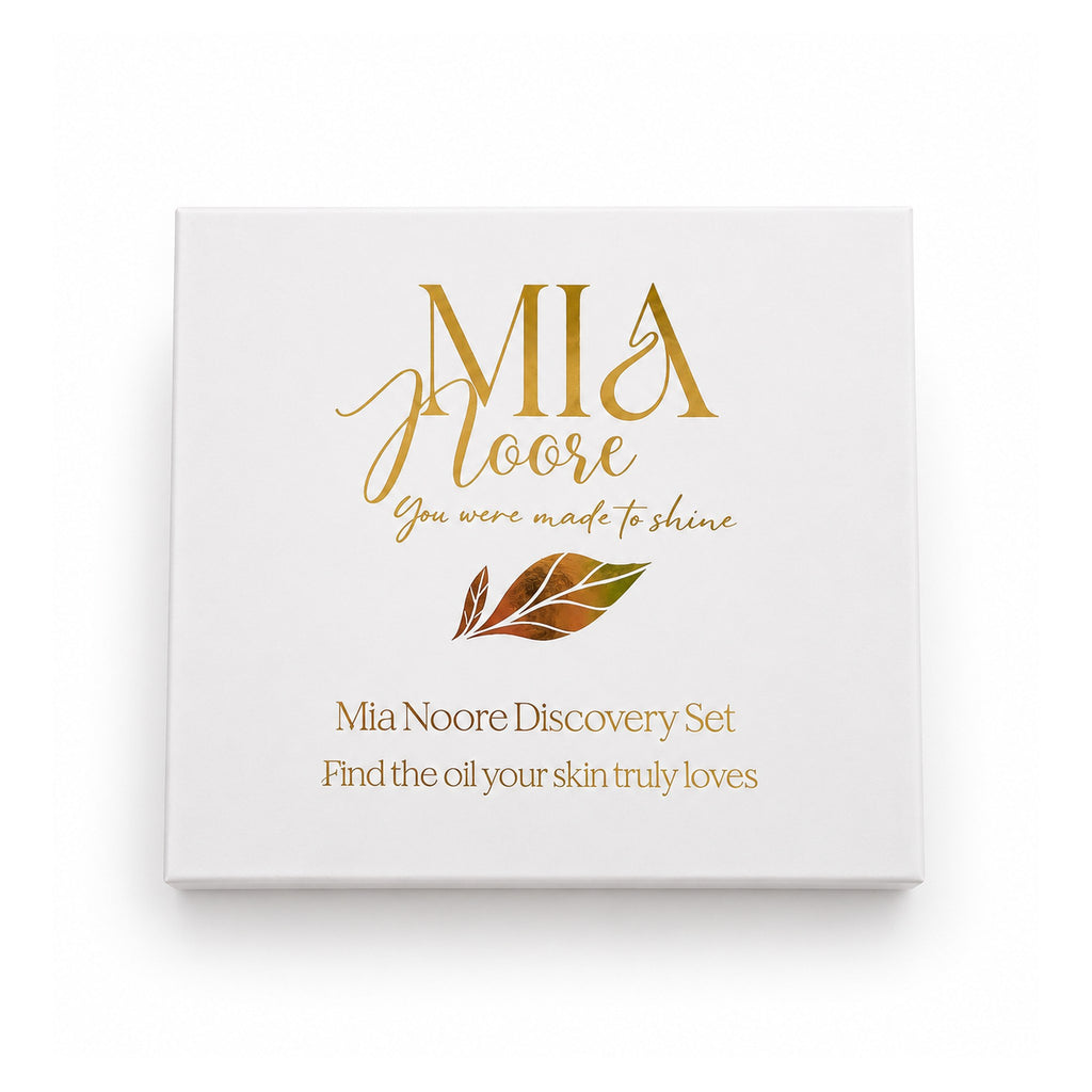 The Mia Noore Discovery Set gift box, white with a gold foil logo and the words Find the oil your skin truly loves